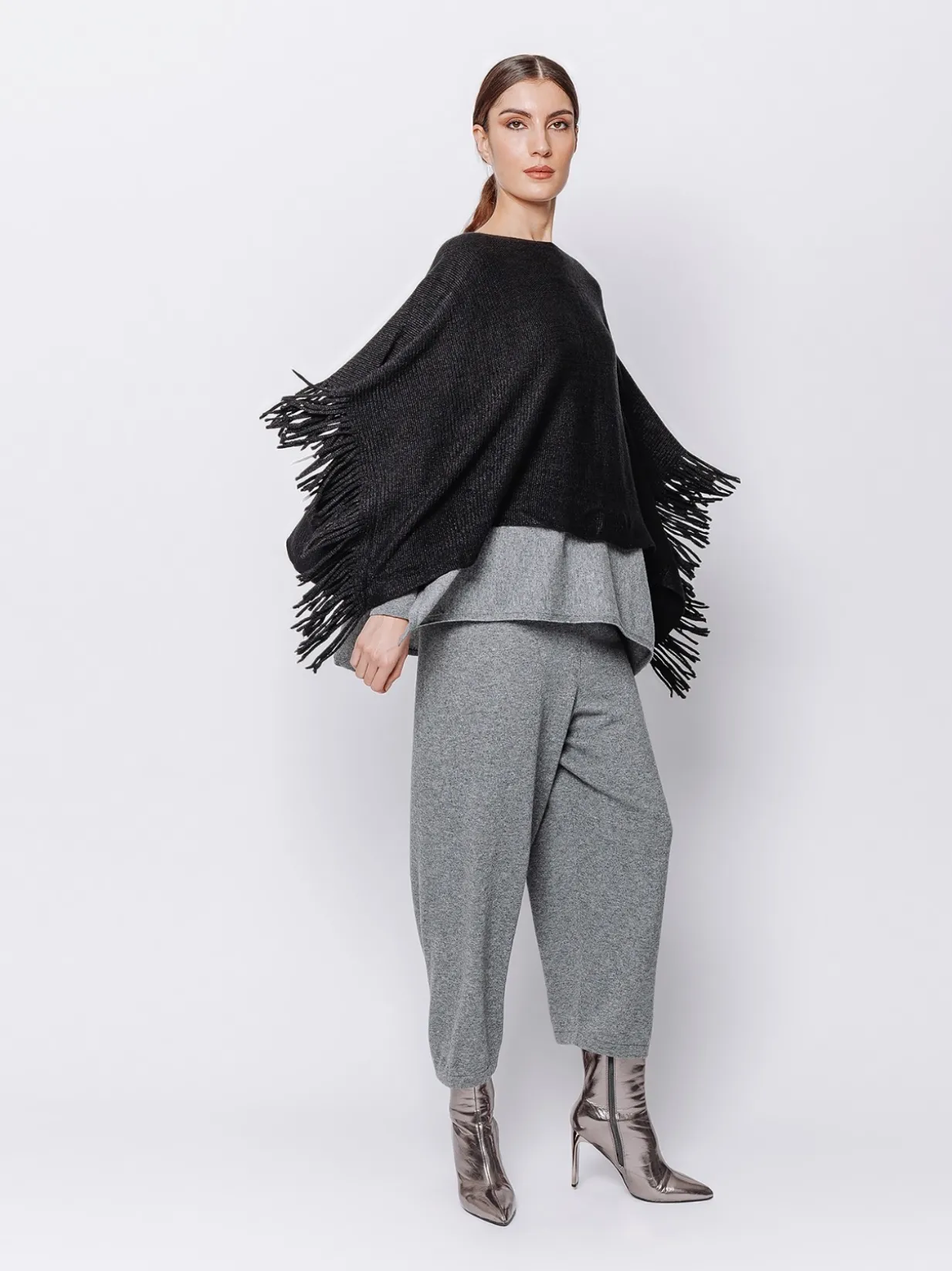 Poncho in maglia con frange