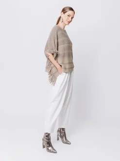 Poncho in maglia con frange